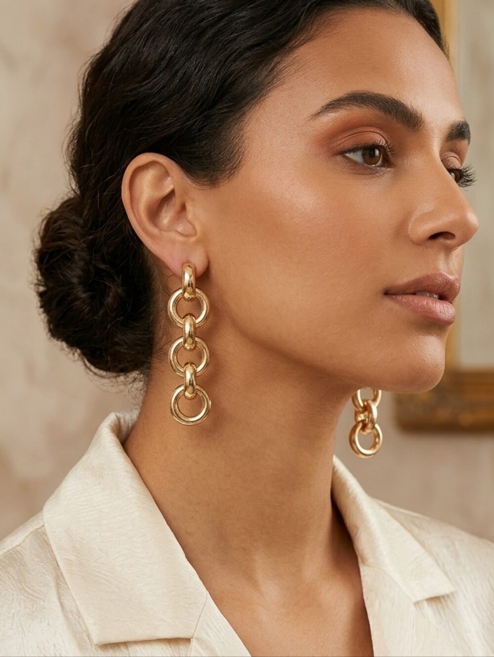 Long earrings made with three interlocking twisted circle pieces